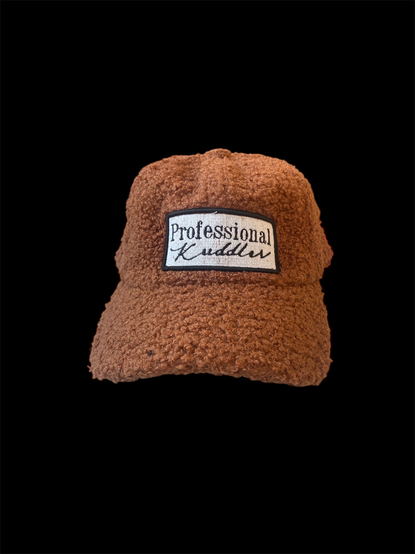 “Professional Kuddler” patch fuzzy 5 panel trucker hat.