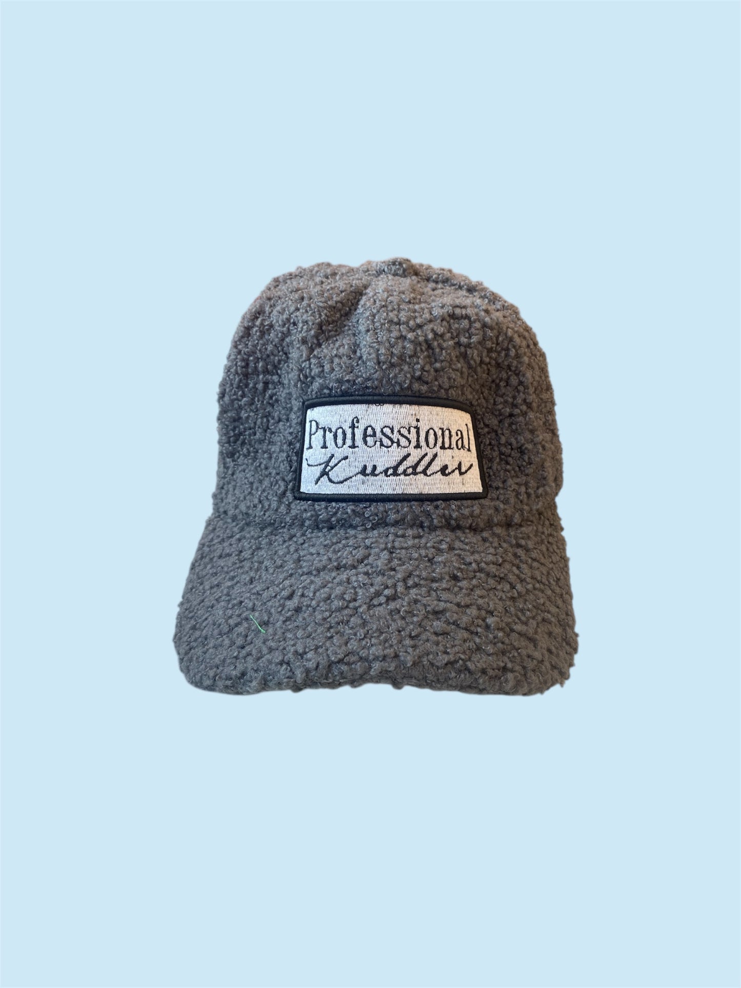 “Professional Kuddler” patch fuzzy 5 panel trucker hat.